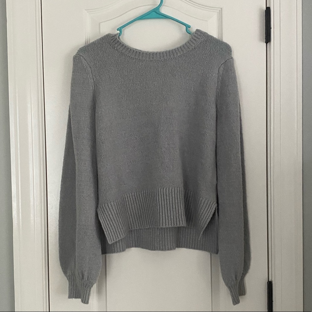 grey sweater w buttons on the back